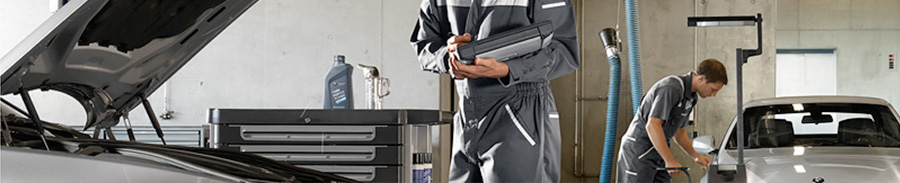 BMW Service Center, Service Employee w/ Customer BMW Service Center, Service Employee w/ Customer