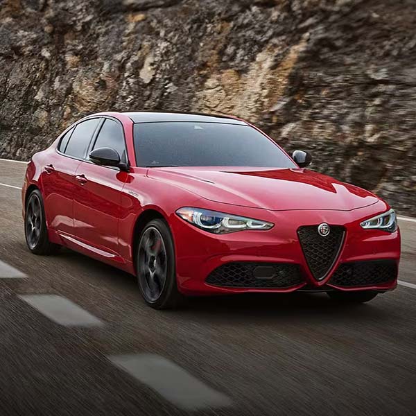 2025 Alfa Romeo Giulia driving on a road.