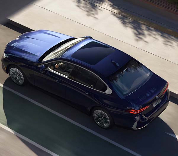 Aerial view of the BMW 5 Series Sedan driving down a highway.