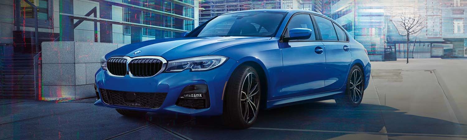 Dynamic head-on driving shot of the 2022 BMW Sedan