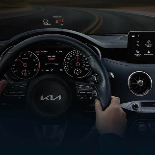 Interior shot of a Kia steering wheel.