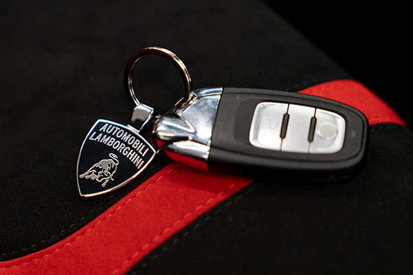 Car keys sitting on fabric.