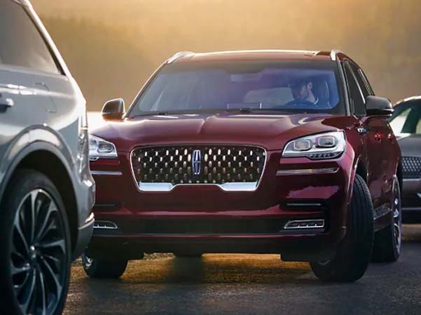 View of a Lincoln driving on a highway