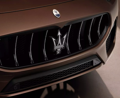 Detail shot of a 2023 Maserati Grecale front emblem.